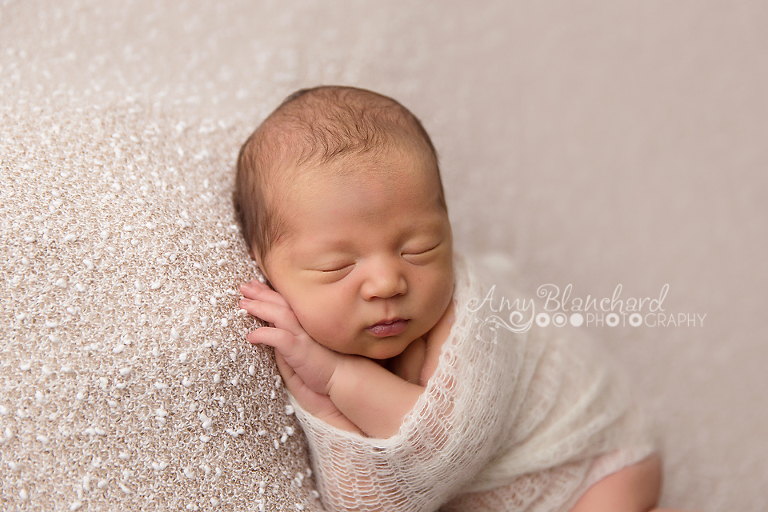 Omaha Newborn Photographer Baby Wrapped in Cream